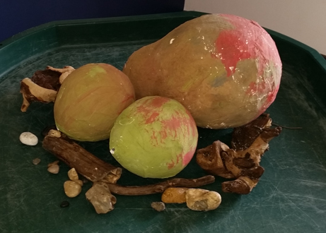 Dinosaur eggs made from a balloon covered in paper mache.