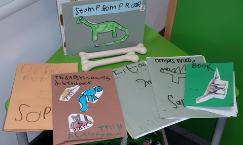 "Stomp, stomp, roar"!  Reception class make books about dinosaurs.