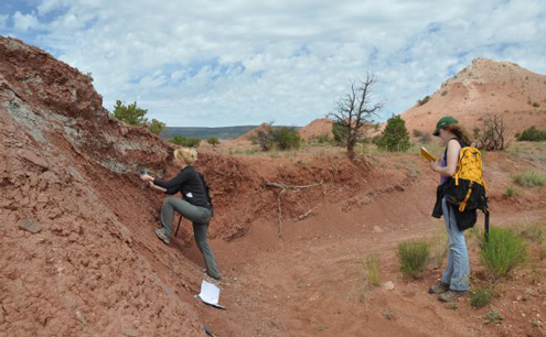 Researchers Jessica Whiteside and Maria Dunlavey taking rock samples for analysis of the isotopic signature of organic carbon at Ghost Ranch, New Mexico. These data help reconstruct ecosystem productivity and environmental changes in the Triassic.