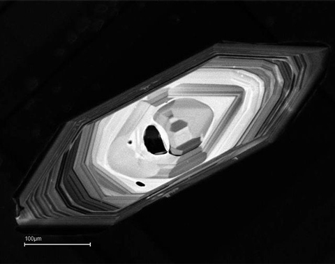 The zircon is about the width of a human hair.
