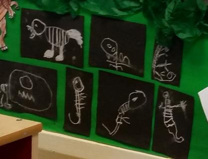 Reception class uses different materials to explore dinosaurs.