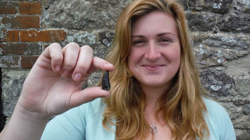 Palaeontology student Megan Jacobs holding the Eotyrannus tooth she found.