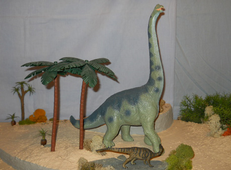 The Camptosaurus model provides a scale to the larger Brachiosaur replica.