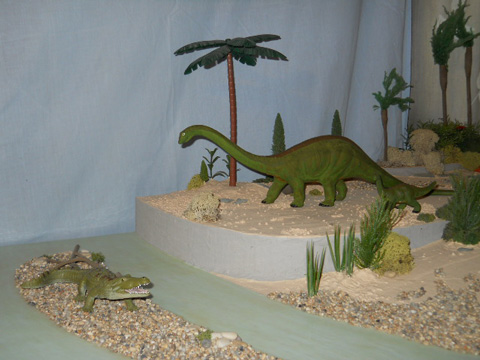 Dinosaurs encounter a crocodile.