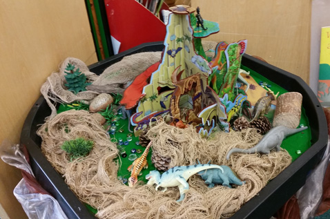 Year 1 children explore dinosaur habitats.