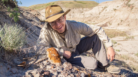 PhD student Scott Persons showing the location of the fossil skull.