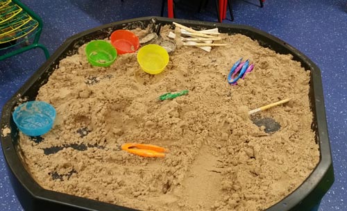 Reception class dig for dinosaurs.