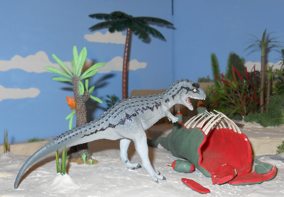 A Carnotaurus feeds on a Sauropod carcase.