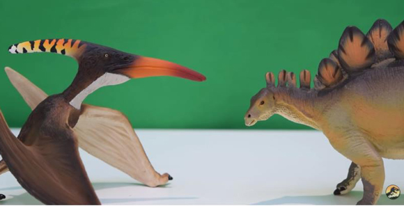 Comparing Safari Ltd Stegosaurus and Pteranodon models.