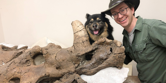 Scott Persons with dog and "Hannah" the Styracosaurus.