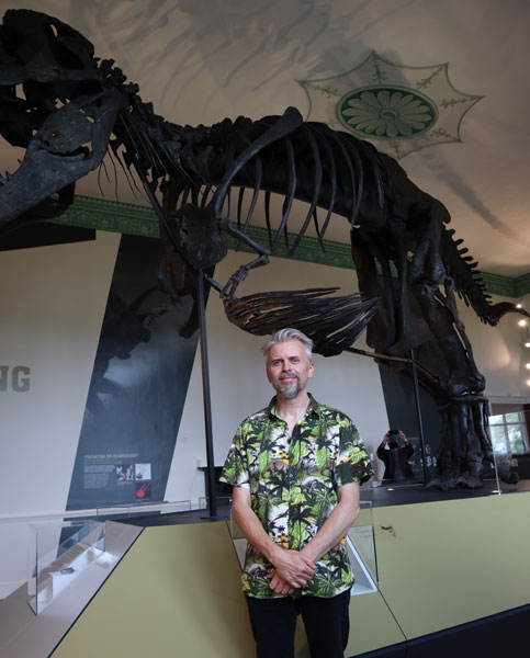 Nigel Larkin next to the Titus T. rex specimen